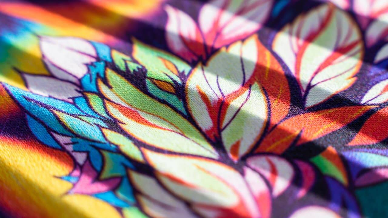 Close-up of vibrant DTF print on cotton fabric showing sharp details and rich colors