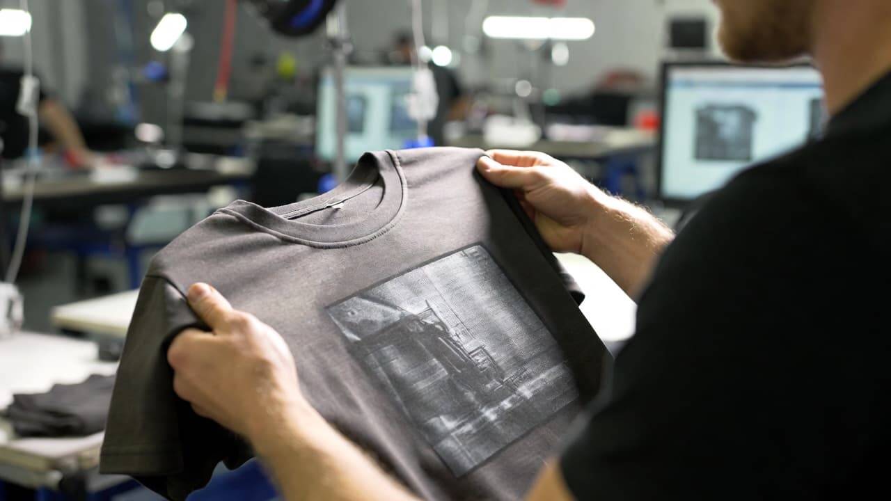 Quality inspection of printed t shirt checking color alignment and print clarity