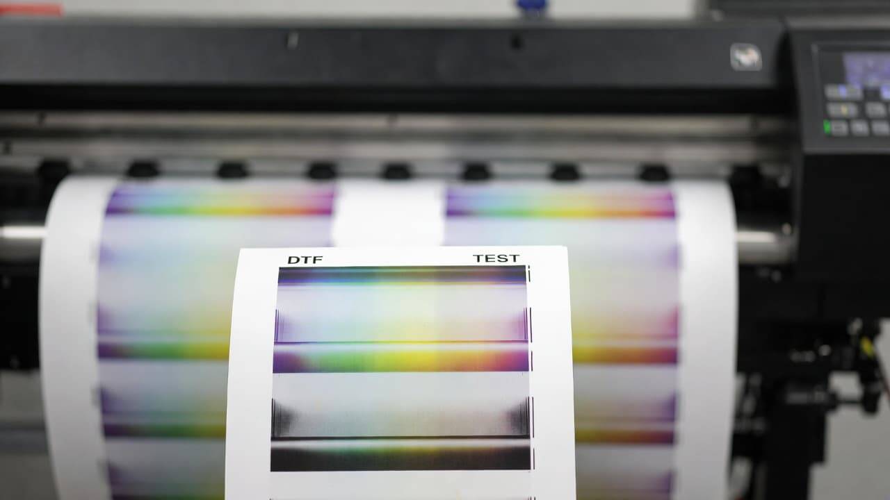 DTF printer test print showing banding and color alignment issues