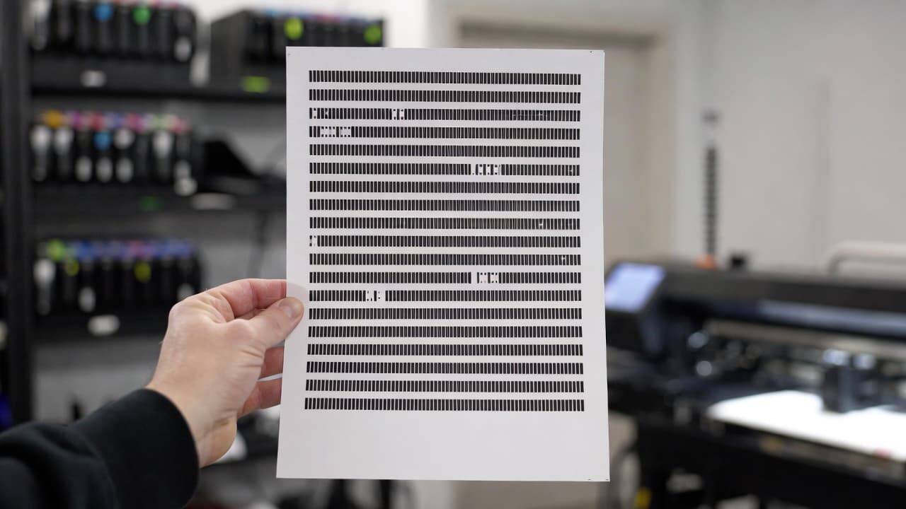 DTG printer nozzle check test pattern showing missing ink lines
